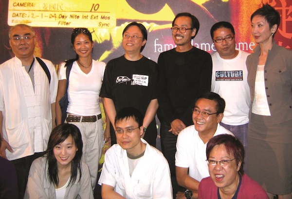 3 September 2004: ‘Fame Flame Frame: Jupiter Wong Foto Exhibition' opening ceremony. (Back row from left) Tang Yat-ming, Crystal Kwok, Shu Kei, Jupiter Wong, Fruit Chan, Nansun Shi; (front row from left) Jo Koo, Abe Kwong, Derek Yee, Ann Hui.